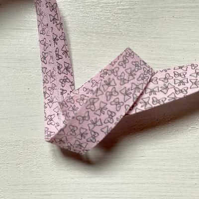 Biais petits noeuds rose