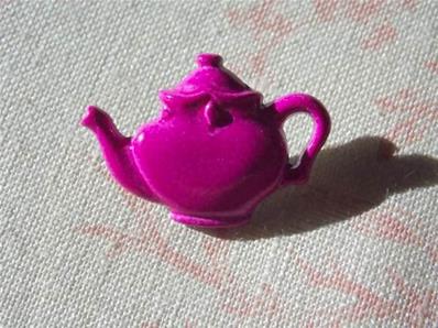 Tea pot metalic button