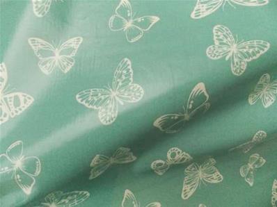 Tissu enduit papillons celadon