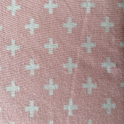 Pink crosses on pink jersey fabric