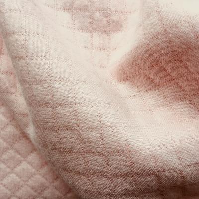 Tissu matelassé rose-pale