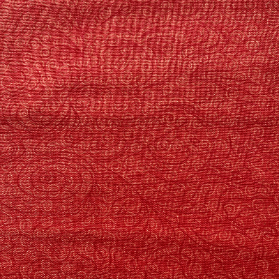 Tissu motifs sur fond rouge / Reste 35 cm