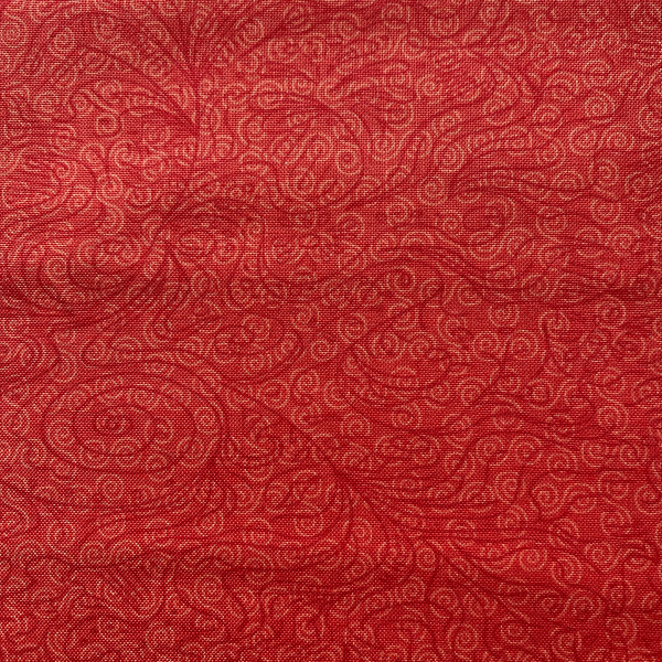 Tissu motifs sur fond rouge / Reste 35 cm
