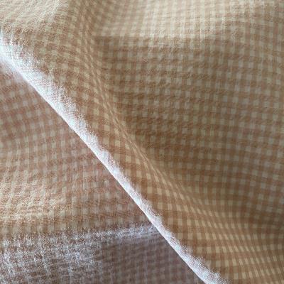 Tissu seersucker à carreaux rose
